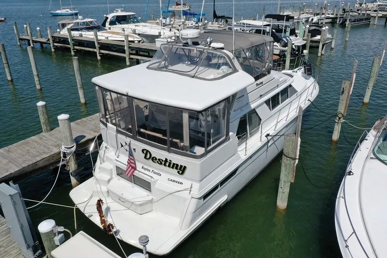 Yacht Photos Pics 1997 Carver 445 Aft Cabin Motor Yacht docked at marina, named "Destiny".