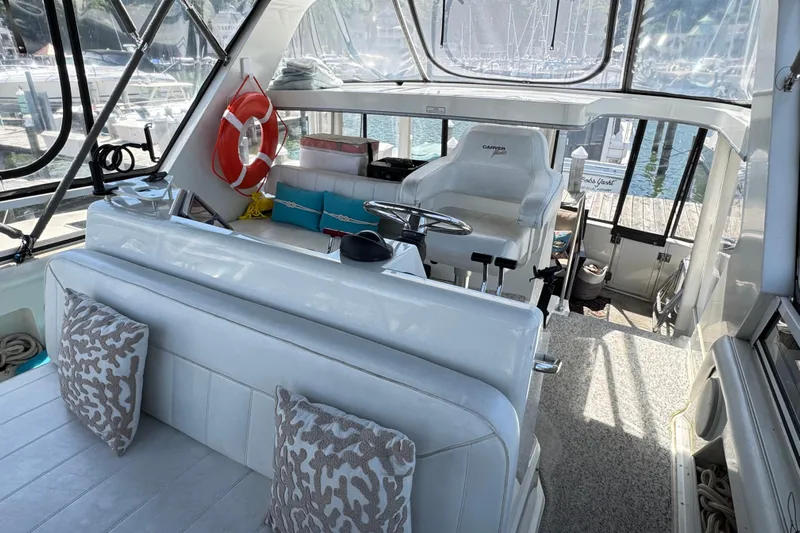  Yacht Photos Pics Interior of 1997 Carver 445 Aft Cabin Motor Yacht with helm and seating area.