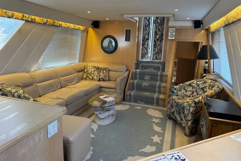  Yacht Photos Pics Luxurious interior of a 1997 Carver 445 Aft Cabin Motor Yacht with plush seating and elegant decor.