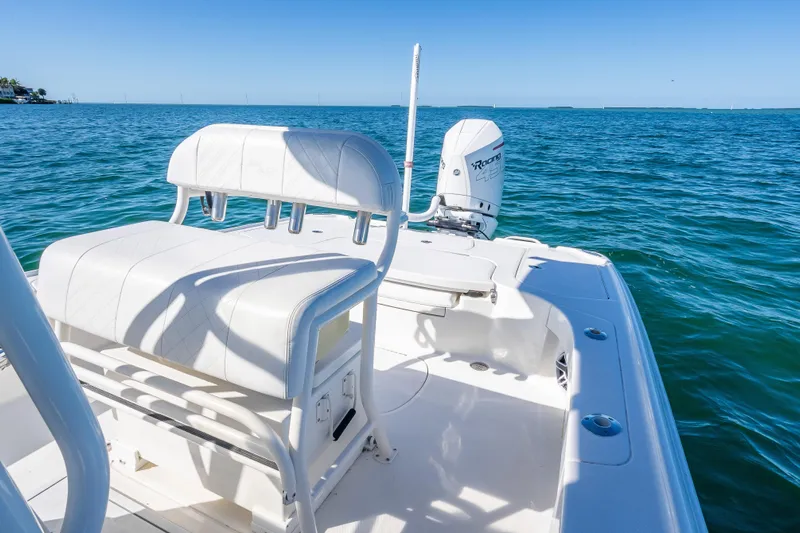  Yacht Photos Pics 2017 SeaVee 270Z boat with white seating and outboard motor on blue ocean.