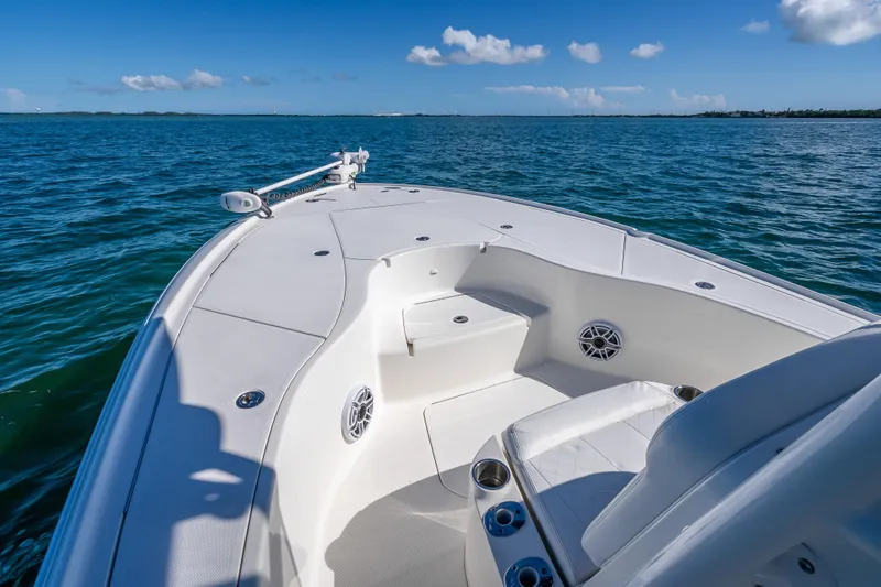  Yacht Photos Pics 2017 SeaVee 270Z boat deck with seating, on calm blue ocean under clear sky.