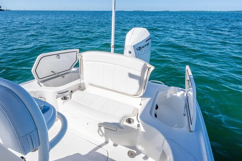  Yacht Photos Pics 2017 SeaVee 270Z boat interior with seating and storage, overlooking blue ocean waters.