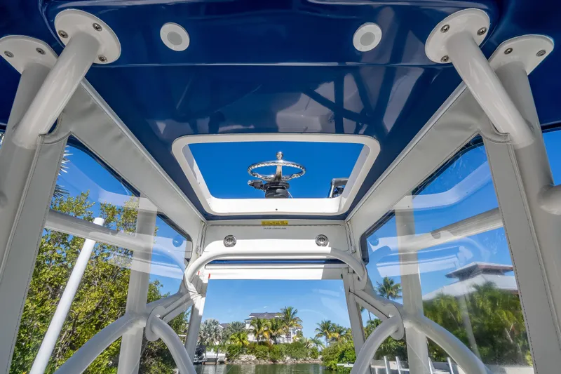  Yacht Photos Pics Interior view of 2017 SeaVee 270Z boat with blue canopy and clear windows.