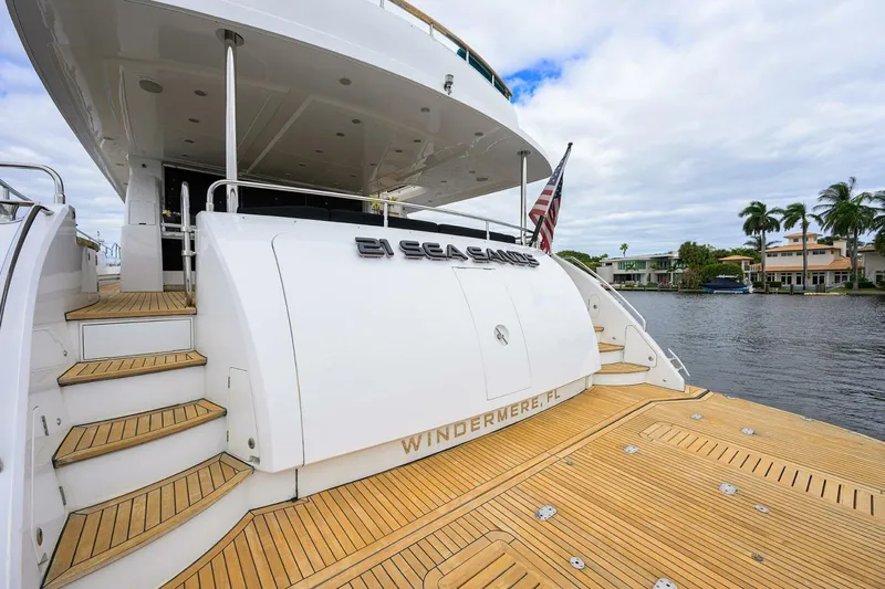 21 Sea Sands Yacht Photos Pics Luxury yacht Princess 95, 2009 model, docked with wooden deck and scenic waterfront view.