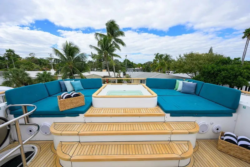 21 Sea Sands Yacht Photos Pics Luxurious 2009 Princess 95 yacht deck with jacuzzi, surrounded by plush seating and tropical scenery.