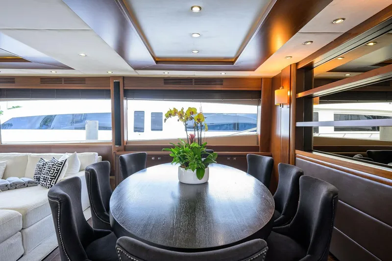 21 Sea Sands Yacht Photos Pics Luxurious interior of 2009 Princess 95 yacht with elegant dining area and modern decor.