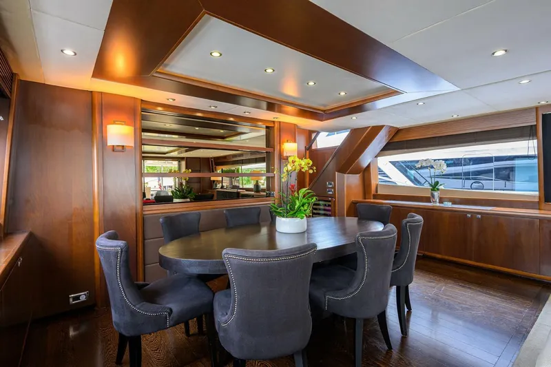 21 Sea Sands Yacht Photos Pics Luxurious dining area on 2009 Princess 95 yacht with elegant seating and wood accents.