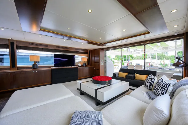 21 Sea Sands Yacht Photos Pics Luxurious interior of 2009 Princess 95 yacht with modern furnishings and large windows.