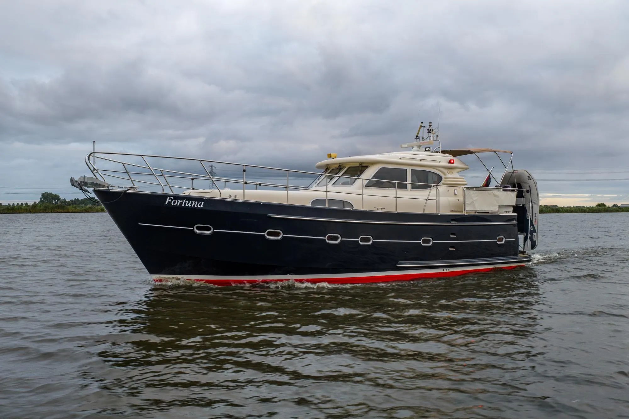 Elling E3 Ultimate 2001 yacht "Fortuna" cruising on a cloudy day.