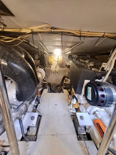  Yacht Photos Pics Engine room of a 2009 Azimut 62 yacht, showcasing mechanical components and wiring.