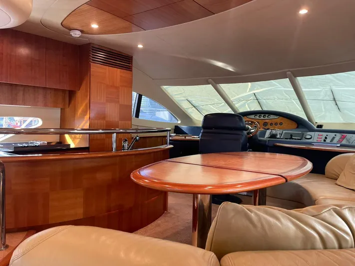  Yacht Photos Pics Luxurious interior of a 2009 Azimut 62 yacht with elegant wood finishes and plush seating.