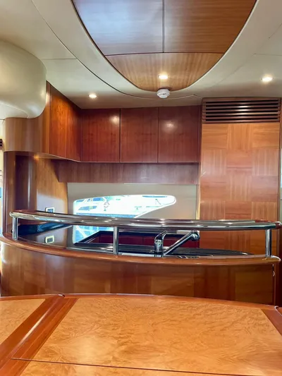  Yacht Photos Pics Interior of 2009 Azimut 62 yacht with elegant wood finishes and modern design.