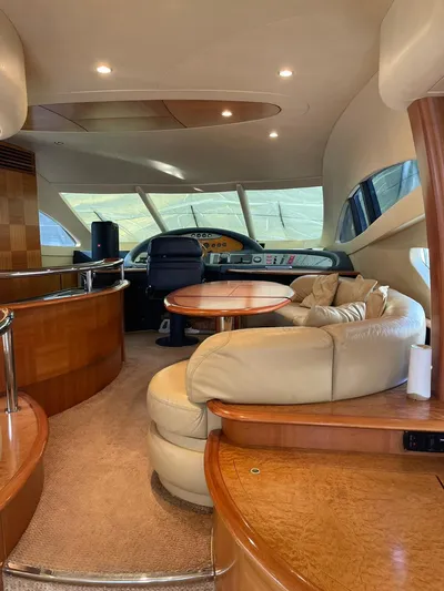  Yacht Photos Pics Luxurious interior of a 2009 Azimut 62 yacht with plush seating and elegant wood finishes.