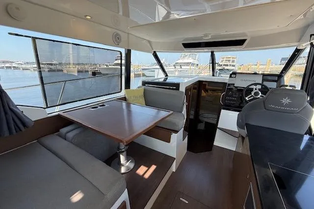  Yacht Photos Pics Interior of 2020 Jeanneau NC 1095 Fly yacht with seating and navigation area.