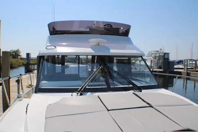  Yacht Photos Pics 2020 Jeanneau NC 1095 Fly yacht docked at marina, front view.