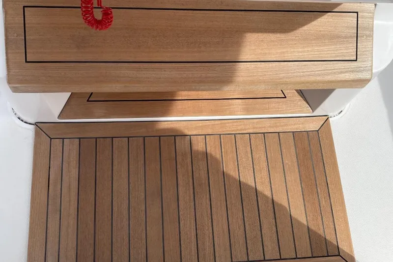  Yacht Photos Pics Teak deck of 2023 Jupiter 32 boat with red safety cord.