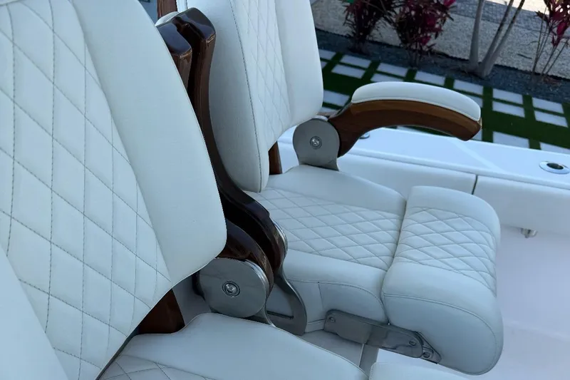  Yacht Photos Pics Luxurious white leather seats on 2023 Jupiter 32 boat, featuring elegant diamond stitching.