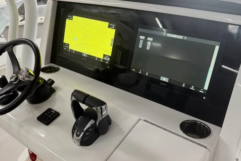  Yacht Photos Pics 2023 Jupiter 32 boat dashboard with dual Garmin displays and steering wheel.