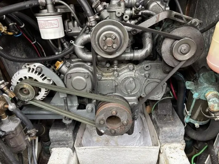 Seacape Yacht Photos Pics Engine compartment of a 1996 Hylas 46 sailboat, showing belts and components.