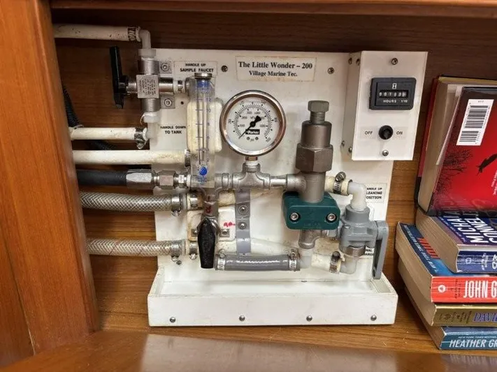 Seacape Yacht Photos Pics Control panel of a 1996 Hylas 46 yacht with pressure gauge and pipes.