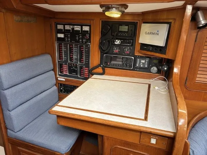 Seacape Yacht Photos Pics Navigation station on a 1996 Hylas 46 yacht with Garmin equipment and control panels.