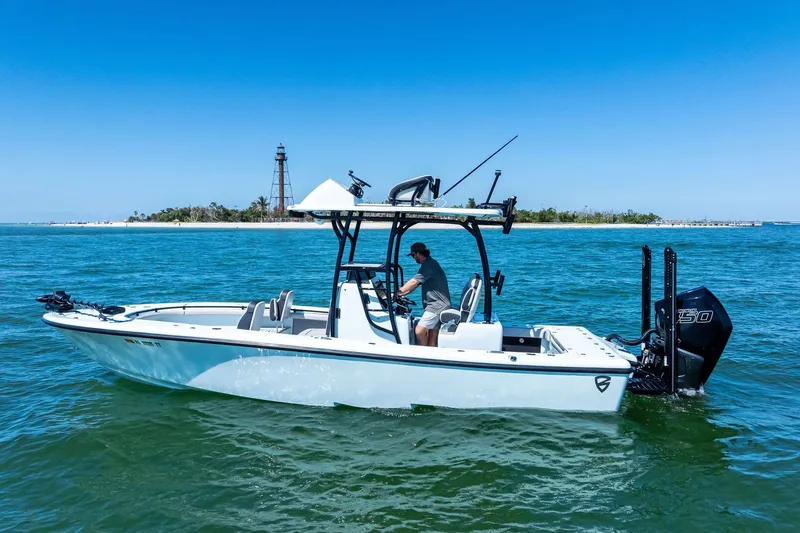  Yacht Photos Pics 2020 Barker Boatworks 26 Open cruising near a scenic island with a lighthouse.