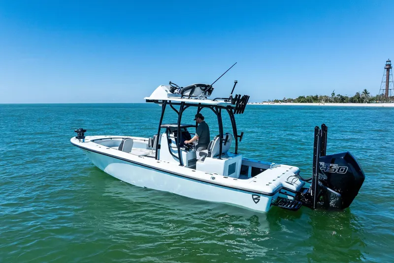  Yacht Photos Pics 2020 Barker Boatworks 26 Open on calm ocean near lighthouse.