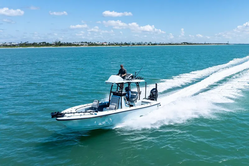  Yacht Photos Pics 2020 Barker Boatworks 26 Open cruising on clear blue water under a sunny sky.