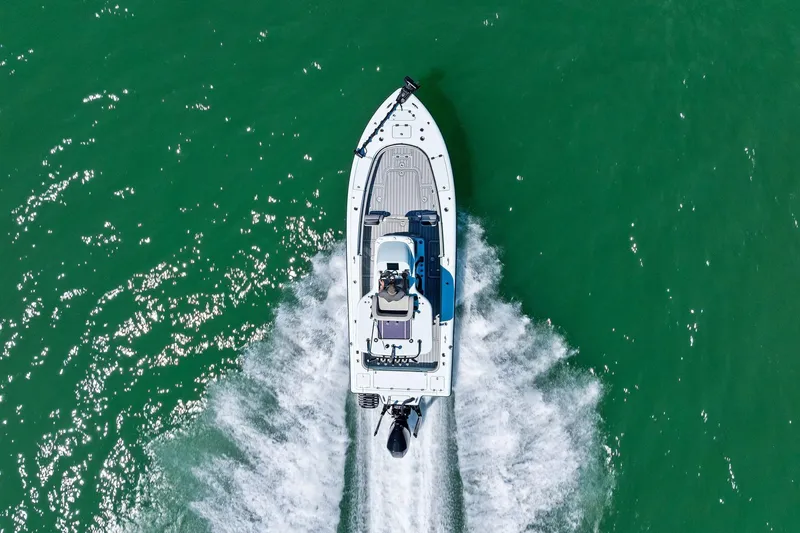  Yacht Photos Pics Aerial view of 2020 Barker Boatworks 26 Open speeding on green water.