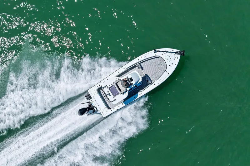  Yacht Photos Pics Aerial view of 2020 Barker Boatworks 26 Open speeding on green water.