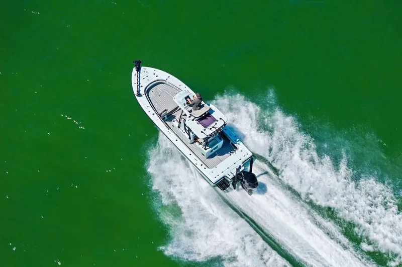  Yacht Photos Pics Aerial view of 2020 Barker Boatworks 26 Open speeding on green water.