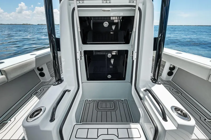  Yacht Photos Pics 2020 Barker Boatworks 26 Open interior with storage compartments, sleek design, and ocean backdrop.
