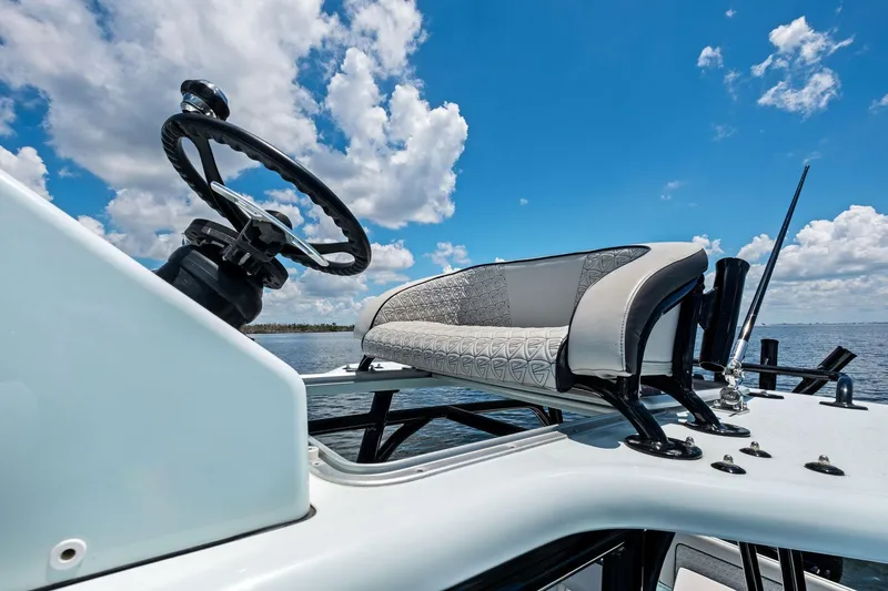  Yacht Photos Pics 2020 Barker Boatworks 26 Open helm with stylish seating under a bright blue sky.