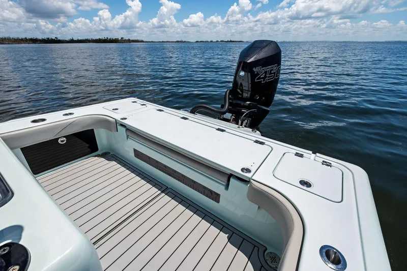  Yacht Photos Pics 2020 Barker Boatworks 26 Open on water, featuring spacious deck and powerful outboard motor.