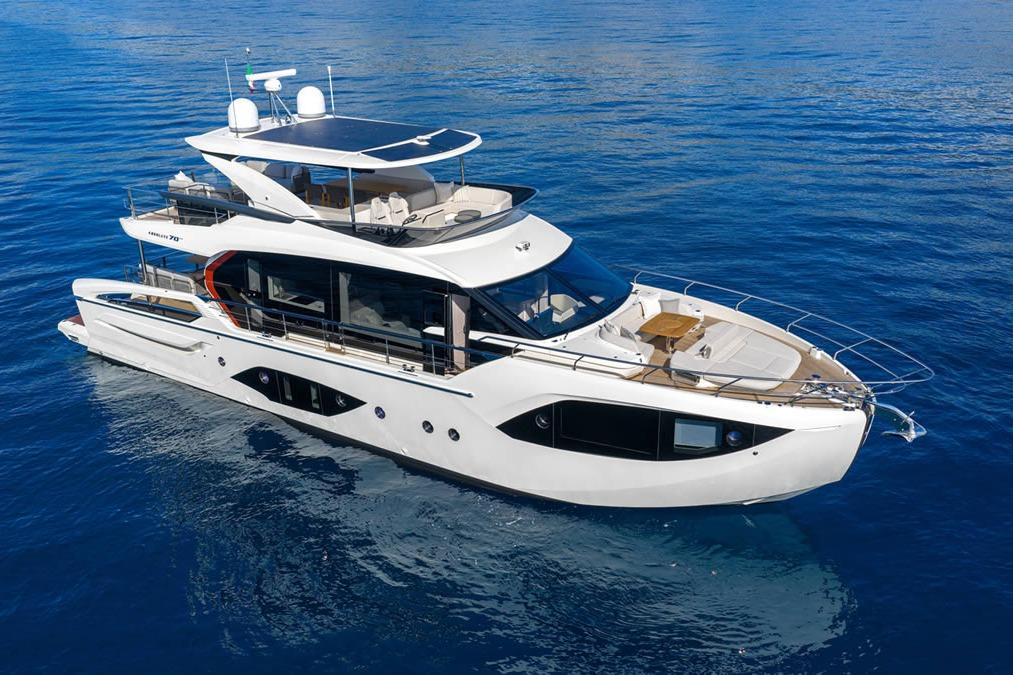 Luxurious 2026 Absolute 70' Fly yacht cruising on serene blue waters.
