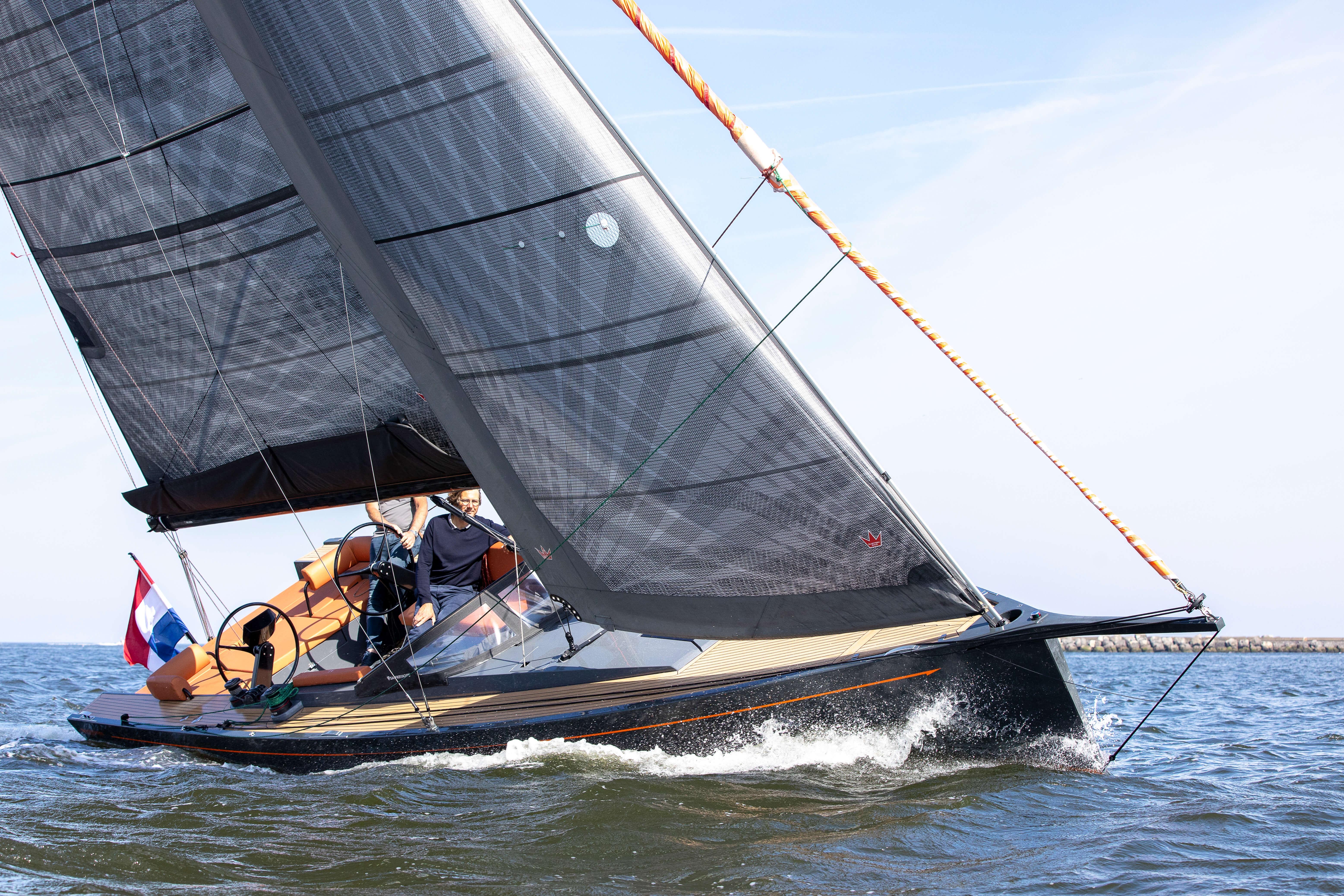 Saffier SE 33 Life 2026 sailing yacht on open water, sleek design, black sails.