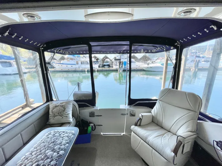 Hailey Brae Yacht Photos Pics Interior view of a 2021 Custom Express Cruiser with marina backdrop.