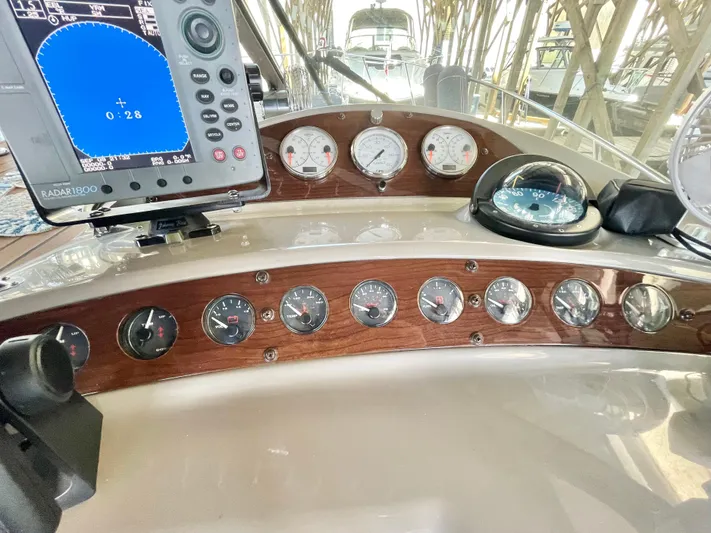 Hailey Brae Yacht Photos Pics Dashboard of 2021 Custom Express Cruiser with navigation instruments and gauges.