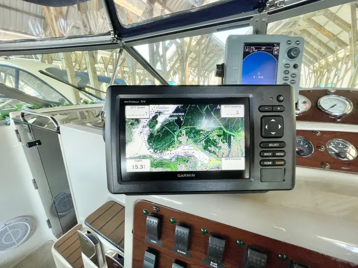 Hailey Brae Yacht Photos Pics Navigation system on 2021 Custom Express Cruiser boat dashboard with Garmin display.
