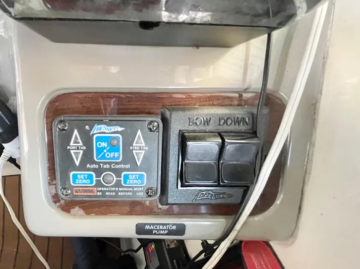 Hailey Brae Yacht Photos Pics Control panel of a 2021 Custom Express Cruiser with auto tab and macerator pump switches.