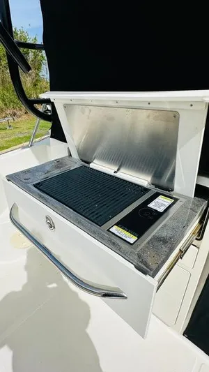  Yacht Photos Pics 2023 Boston Whaler 325 boat grill station with stainless steel cover.