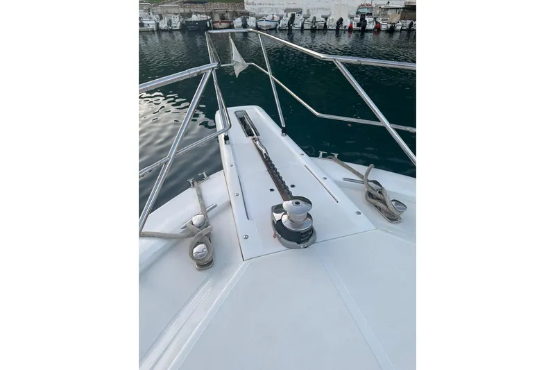  Yacht Photos Pics Bow view of 2005 Uniesse 48 Open yacht docked at marina.