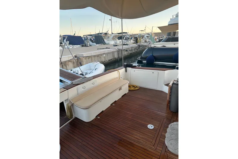  Yacht Photos Pics Luxurious 2005 Uniesse 48 Open yacht with teak deck at marina.