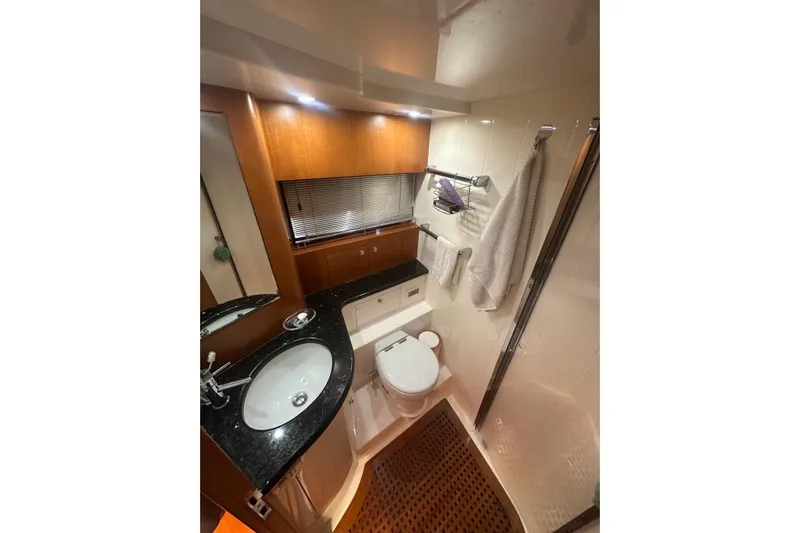  Yacht Photos Pics Luxurious bathroom in 2005 Uniesse 48 Open yacht with modern fixtures and elegant design.