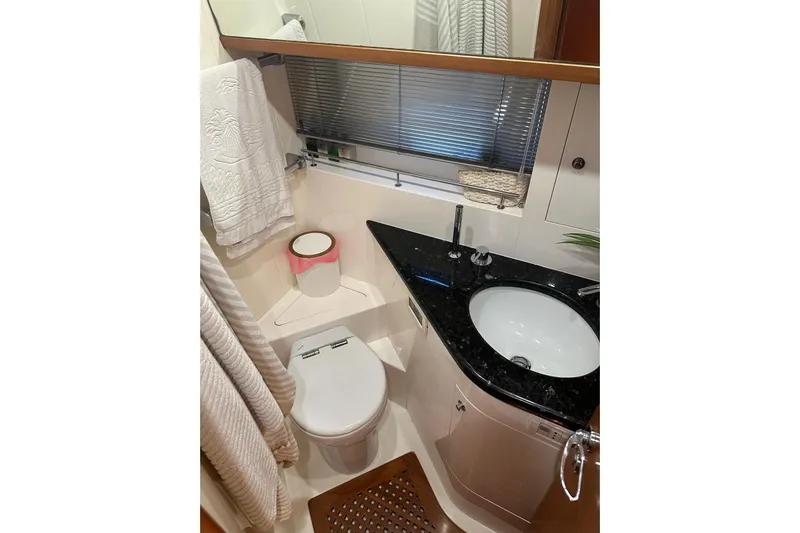  Yacht Photos Pics Luxurious bathroom in 2005 Uniesse 48 Open yacht with modern fixtures and elegant design.