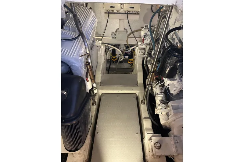  Yacht Photos Pics Engine room of 2005 Uniesse 48 Open yacht, showcasing mechanical components and systems.