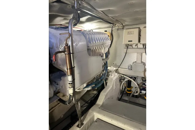  Yacht Photos Pics Engine room of 2005 Uniesse 48 Open yacht, showcasing mechanical components and wiring.