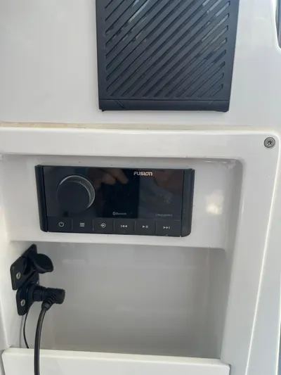  Yacht Photos Pics Control panel of a 2023 RYCK 28 boat featuring a Fusion audio system.