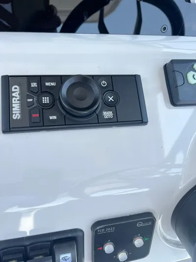  Yacht Photos Pics Control panel of a 2023 RYCK 28 boat featuring Simrad navigation system.