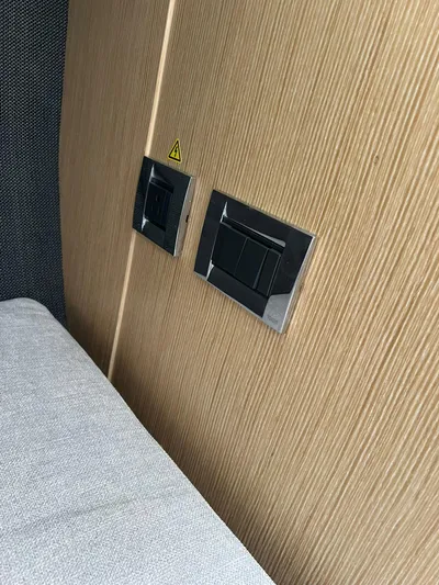  Yacht Photos Pics Power outlets on wooden panel in 2023 RYCK 28 boat interior.